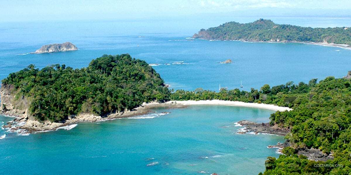 Forested headlands and a white sand beach at Manuel Antonio