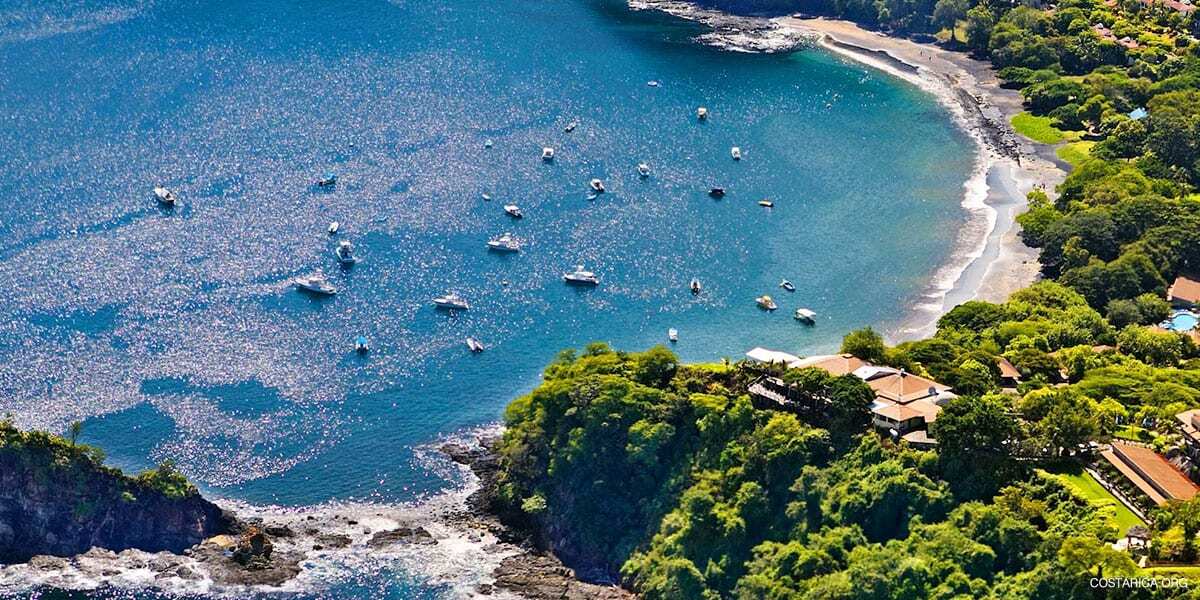 Boats anchored in a turquoise bay on the Papagayo Peninsula, Guanacaste